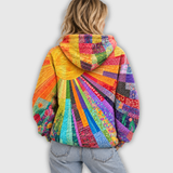 Clara | Oversized huvtröja med solmotiv i patchwork
