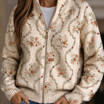 Persephone – Cardigan med blommönster på krämvit botten
